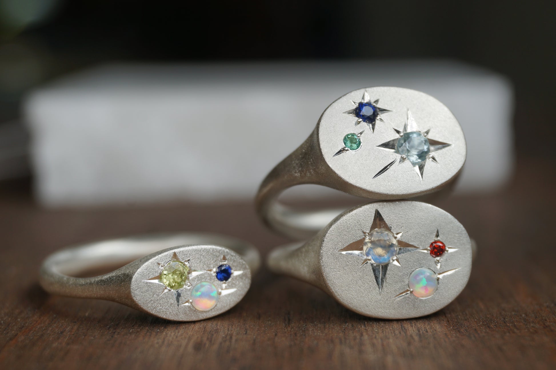 Handcrafted silver signet ring with up to four natural birthstones arranged like a constellation. The Orion Birthstone Signet Ring — personalised, handmade in the UK.