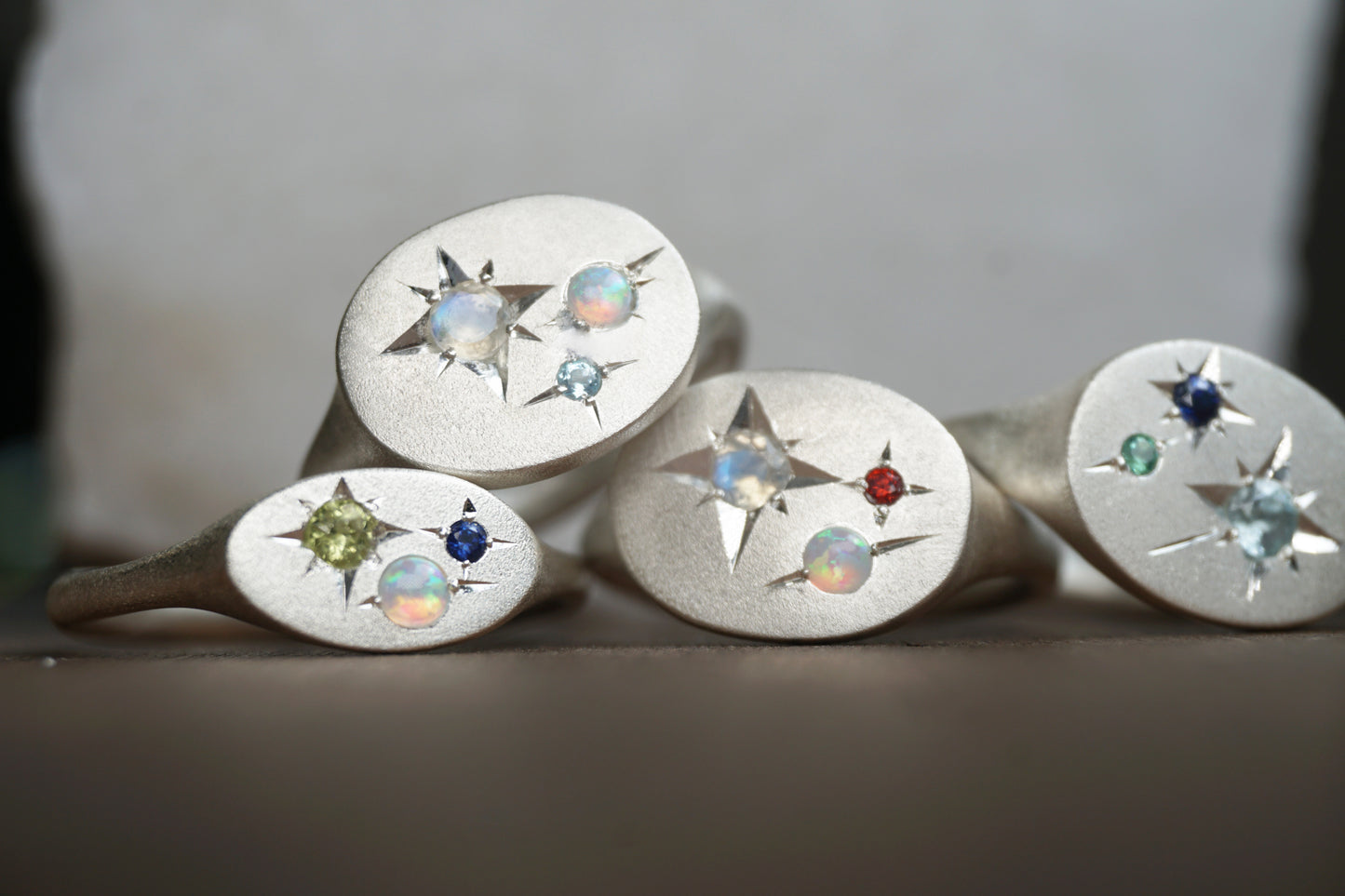 Handcrafted silver signet ring with up to four natural birthstones arranged like a constellation. The Orion Birthstone Signet Ring — personalised, handmade in the UK.