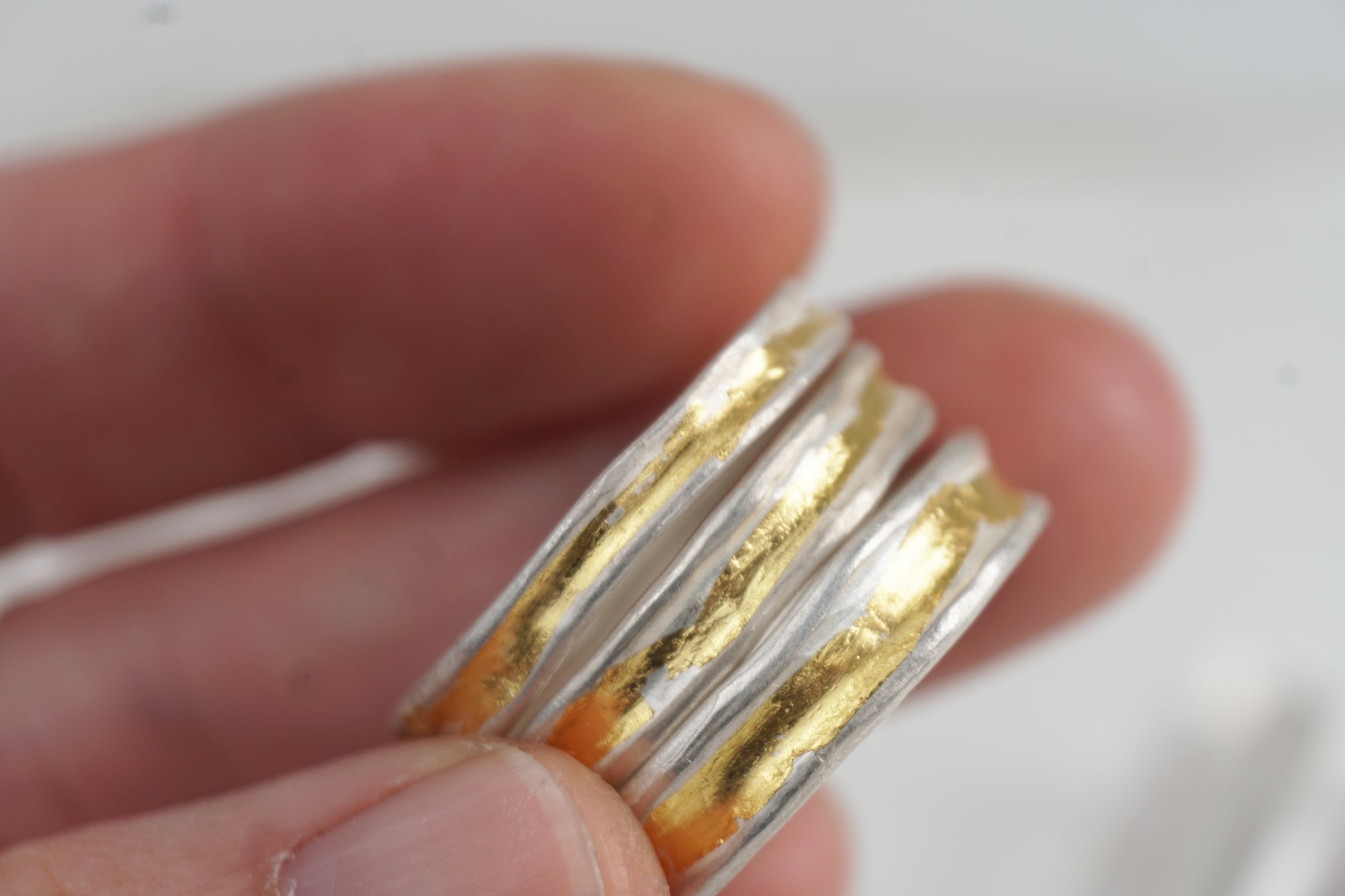 Handcrafted silver ring with 24K Keum-Boo gold fused on the surface, matte texture and organic form — Golden Whisper Ring by Shanho Jewellery UK.