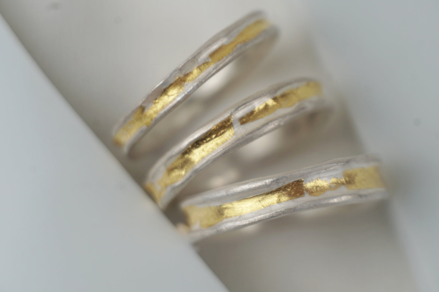 Handcrafted silver ring with 24K Keum-Boo gold fused on the surface, matte texture and organic form — Golden Whisper Ring by Shanho Jewellery UK.